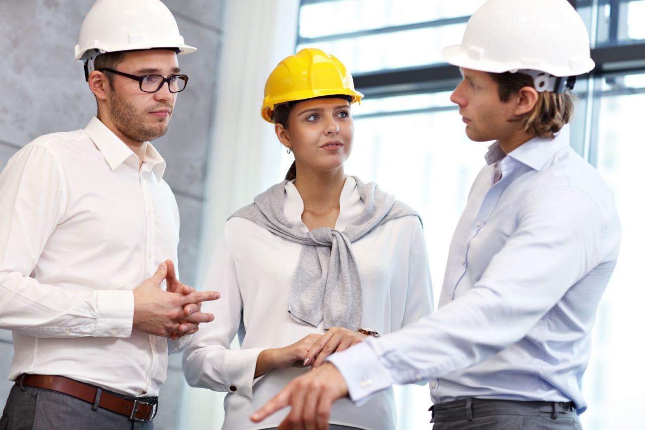 Group of architects sharing ideas in modern office