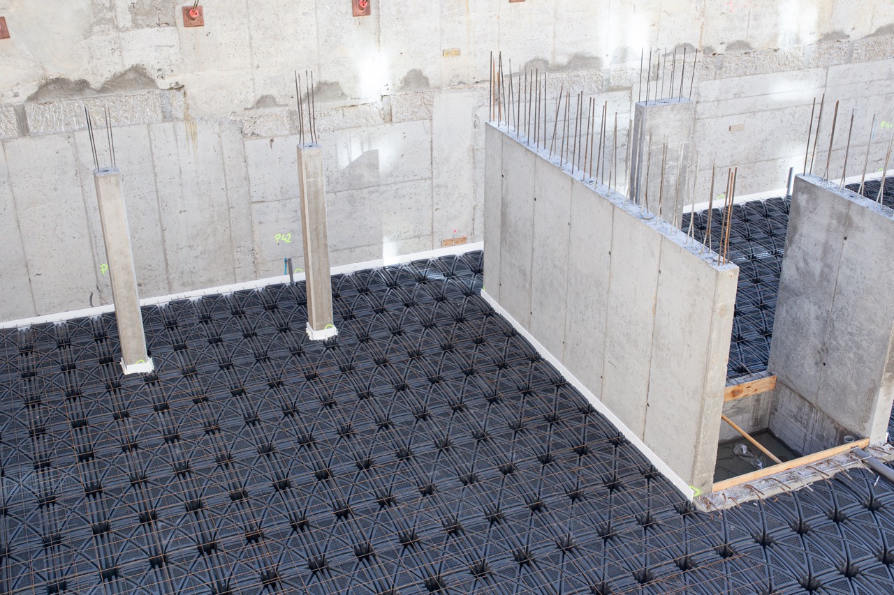 Concrete foundation basement of a building. Suspended slab. Construction site